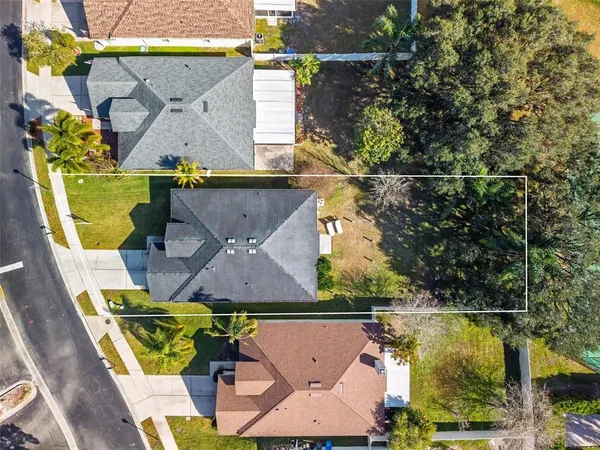 an aerial view of a house with swimming pool
