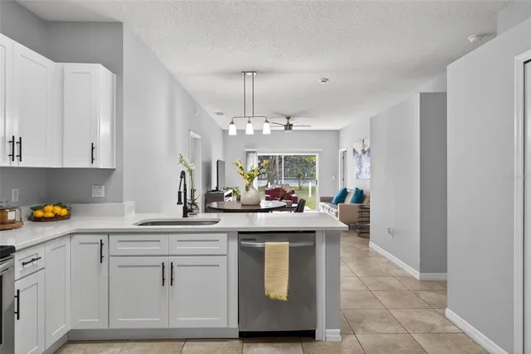 a kitchen with a sink and cabinets