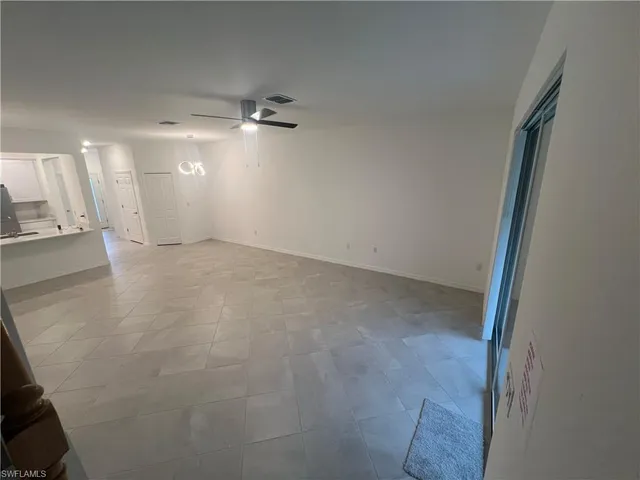 an empty room with a mirror