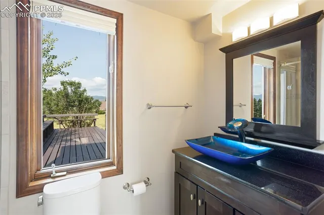 a room with a door and a potted plant
