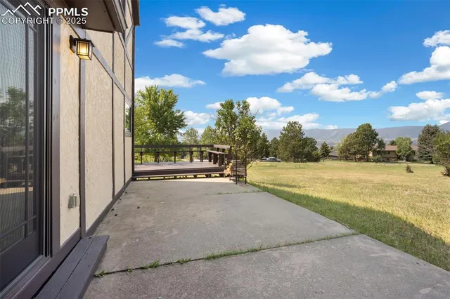 a view of balcony and yard