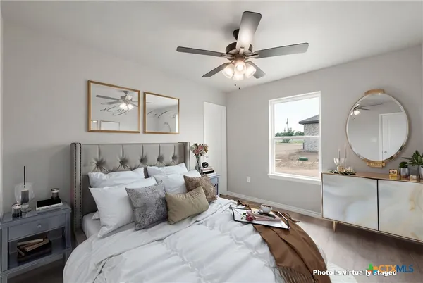 a bedroom with bed and a window