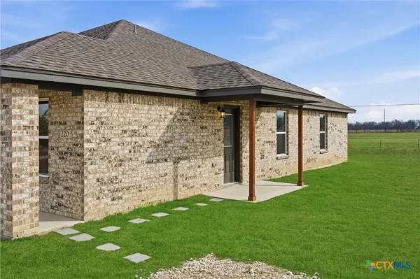 a backyard of a house with lots of green space
