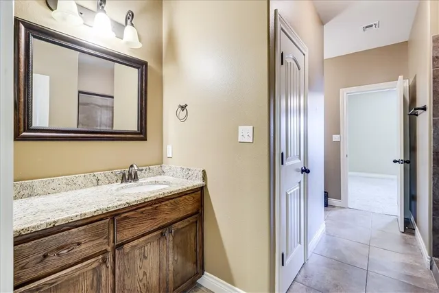 an empty room with a ceiling fan and a large window