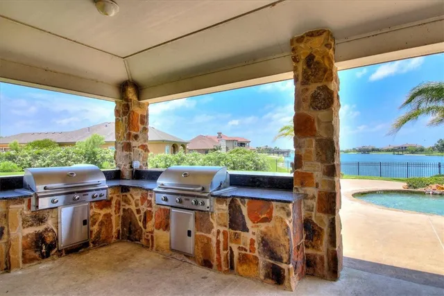 a view of a swimming pool and a yard