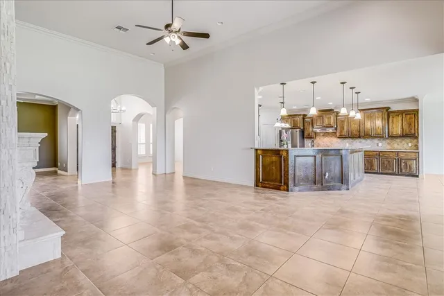 a view of a kitchen with furniture and an open kitchen view