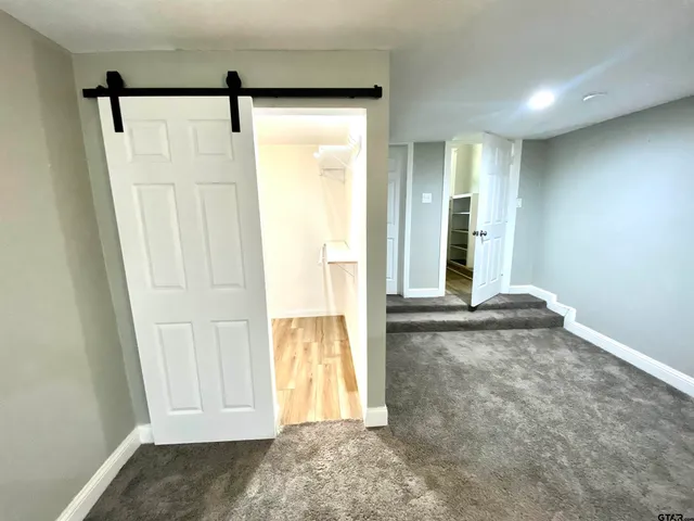 a view of front door with wooden floor