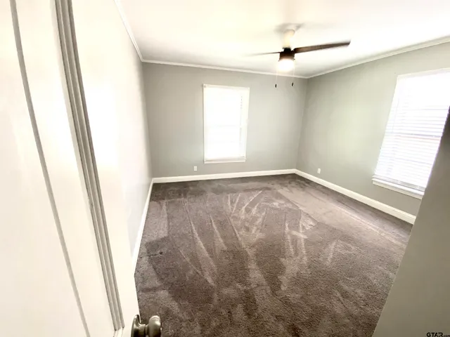 a view of room with window and hardwood floor