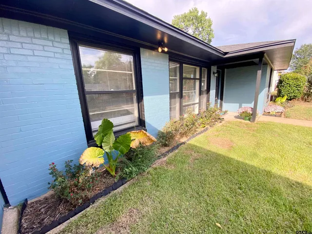 a bathroom with a tub and shower