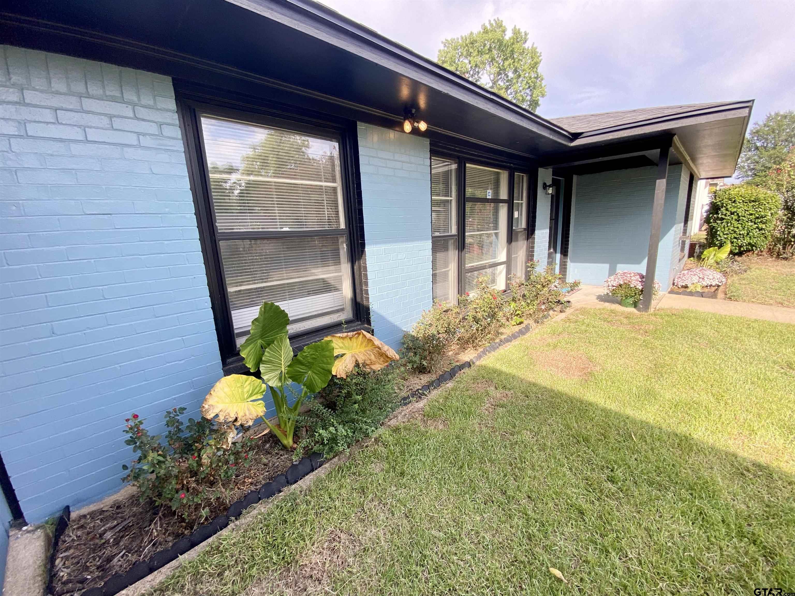 1914 Parklen Street Tyler, TX 75701 - Photo 32 of 39 a bathroom with a tub and shower