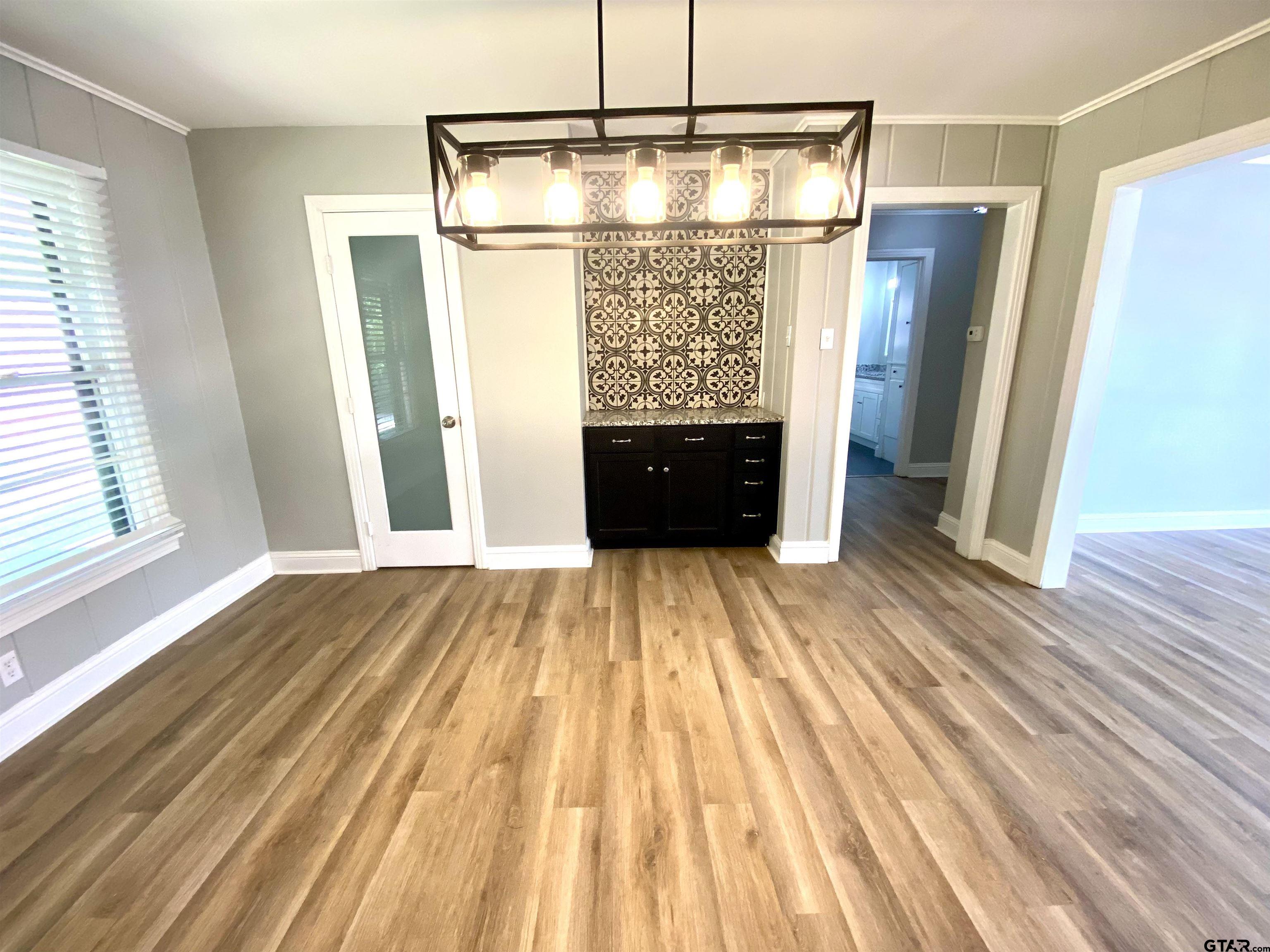 1914 Parklen Street Tyler, TX 75701 - Photo 7 of 39 a view of empty room with wooden floor and fan