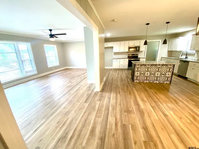 a view of kitchen with cabinets