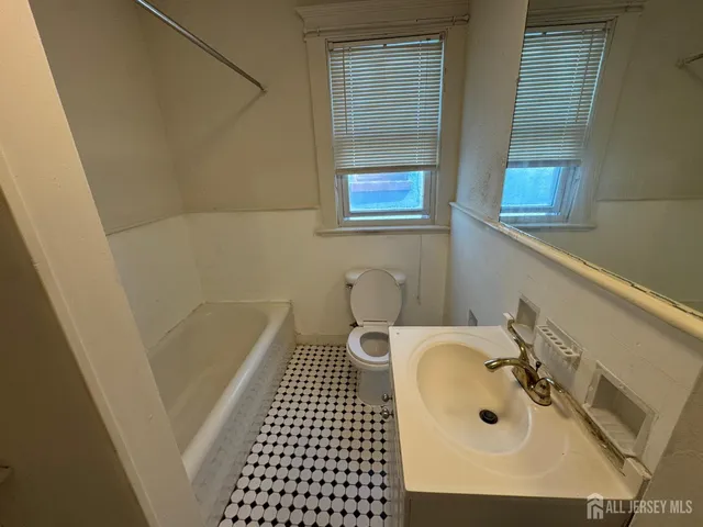 a bathroom with a sink and a shower