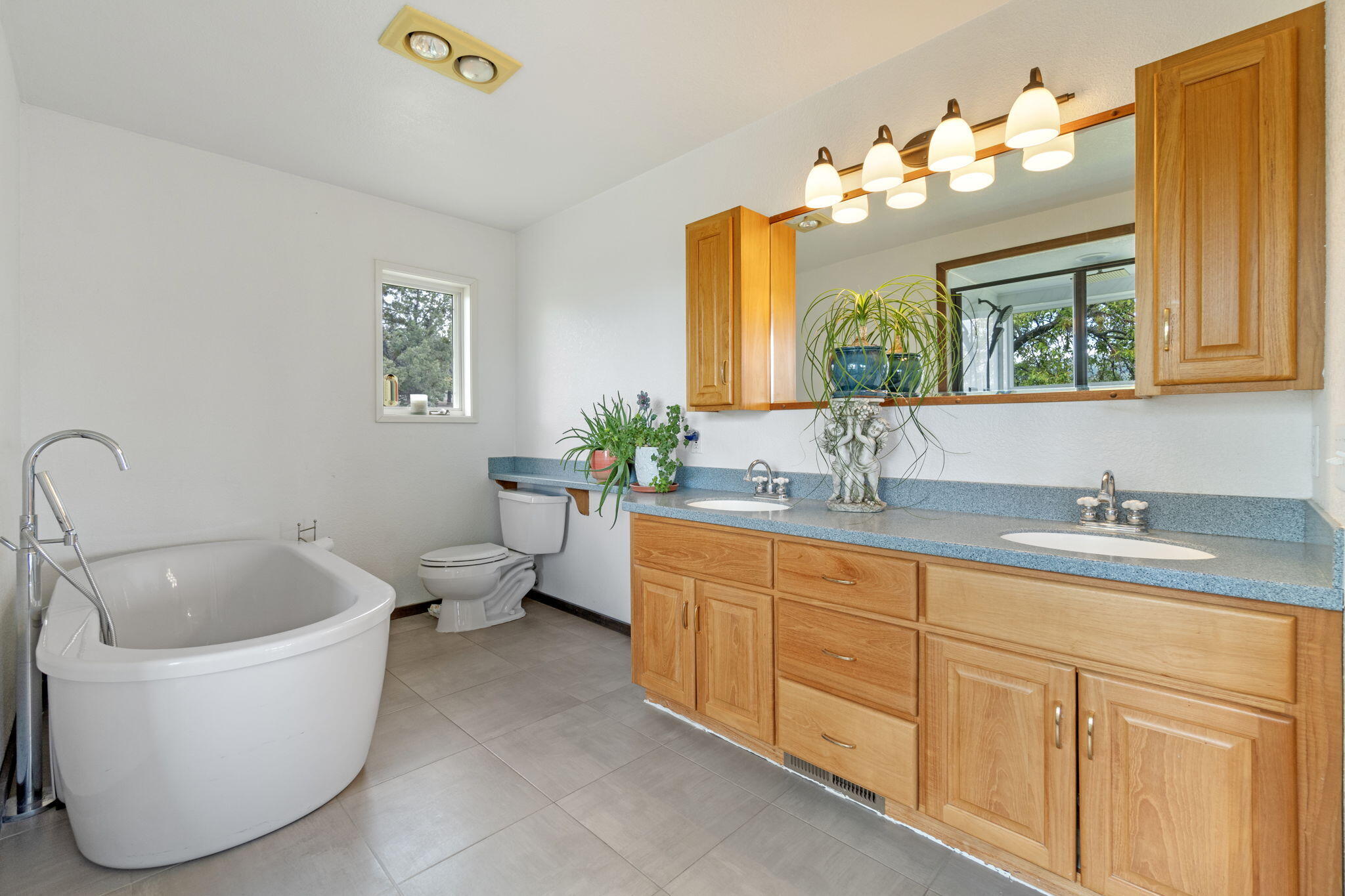 17722 Pope Road Merrill, OR 97633 - Photo 31 of 61 a bathroom with a granite countertop sink and a bathtub