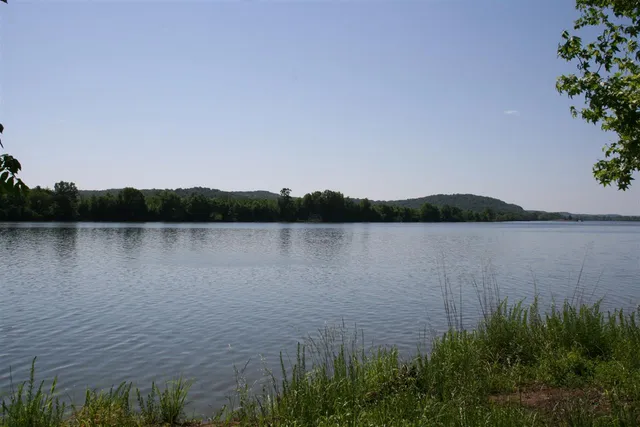 a view of lake with green space
