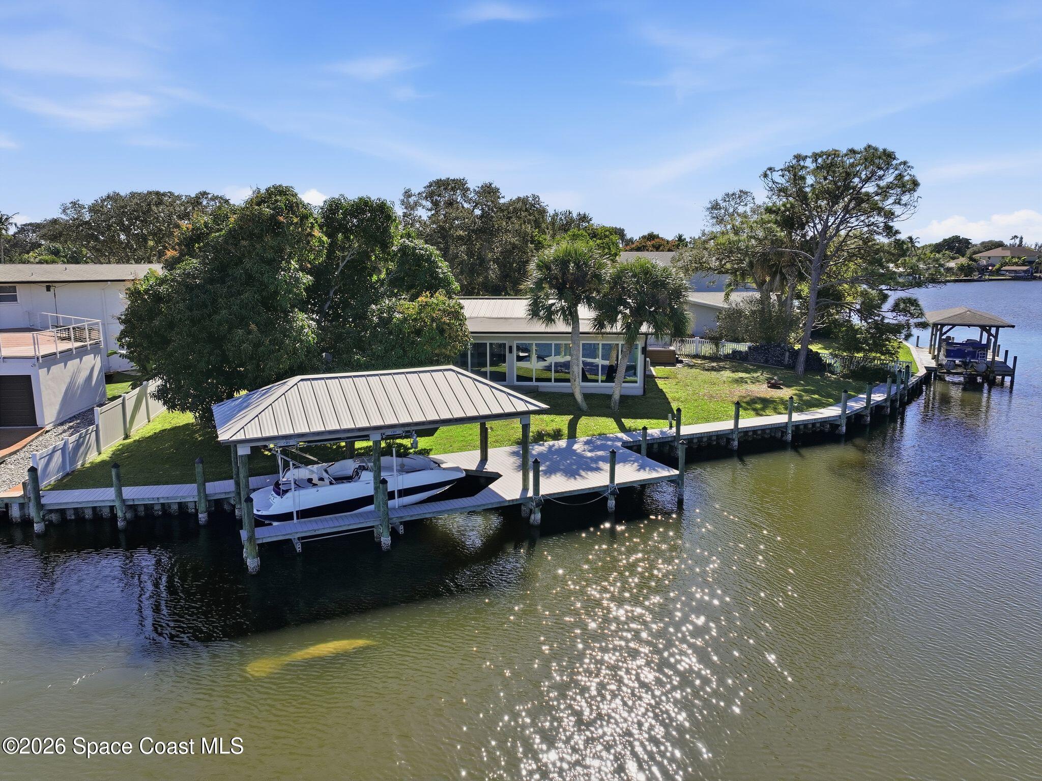a swimming pool with outdoor seating and yard