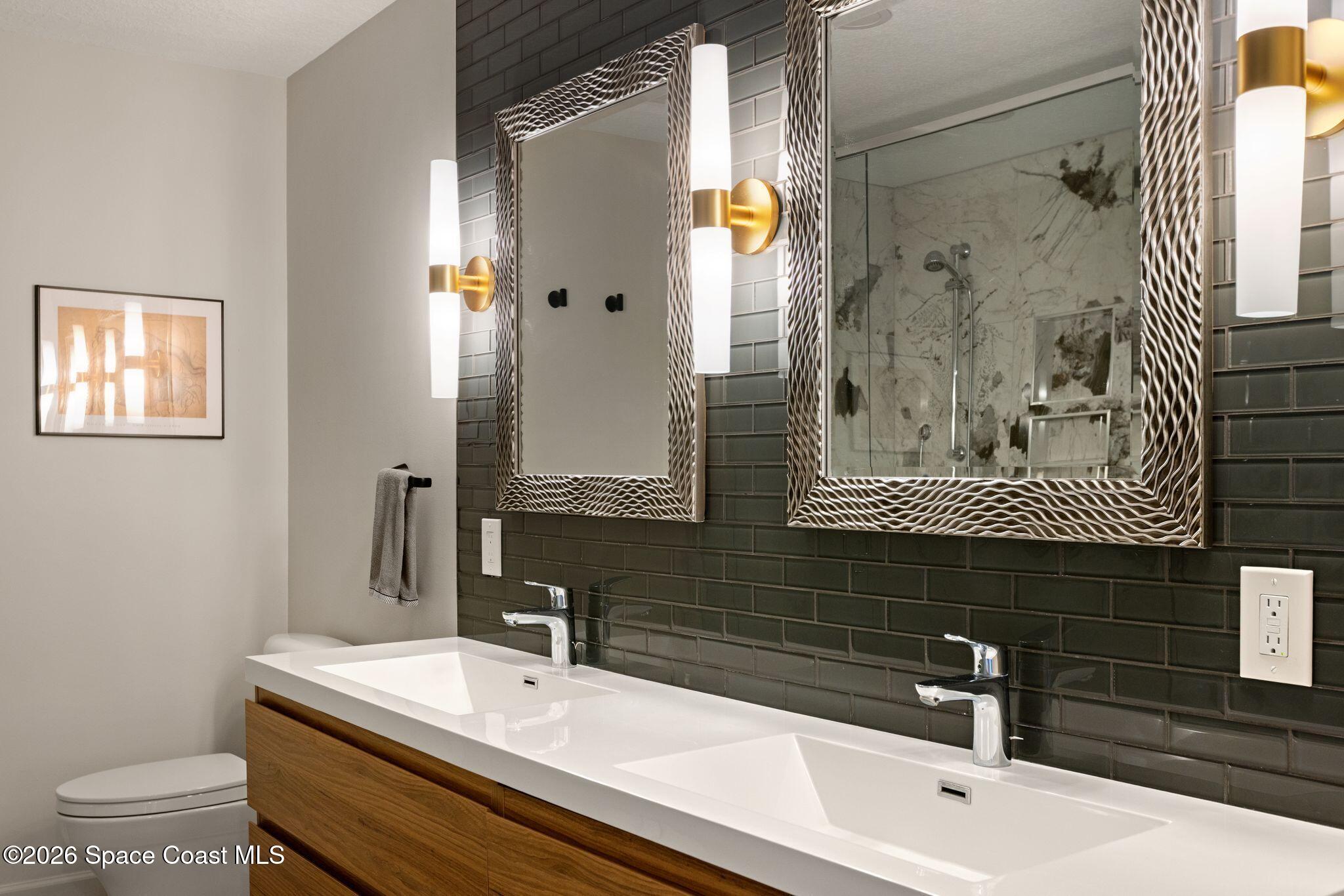 1224 Samar Road Cocoa Beach, FL 32931 - Photo 19 of 56 a bathroom with a sink and a mirror