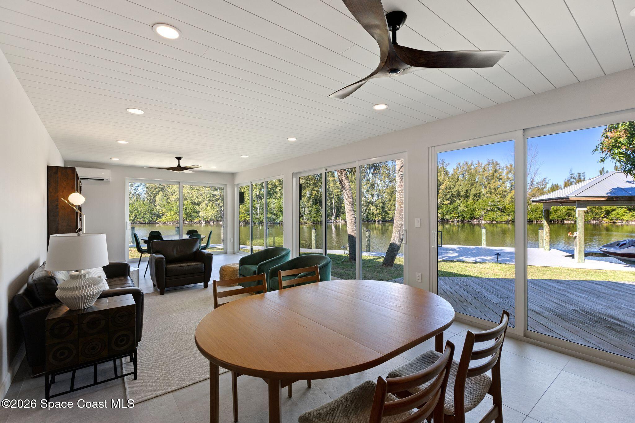 1224 Samar Road Cocoa Beach, FL 32931 - Photo 23 of 56 a view of a dining room with furniture window and outside view