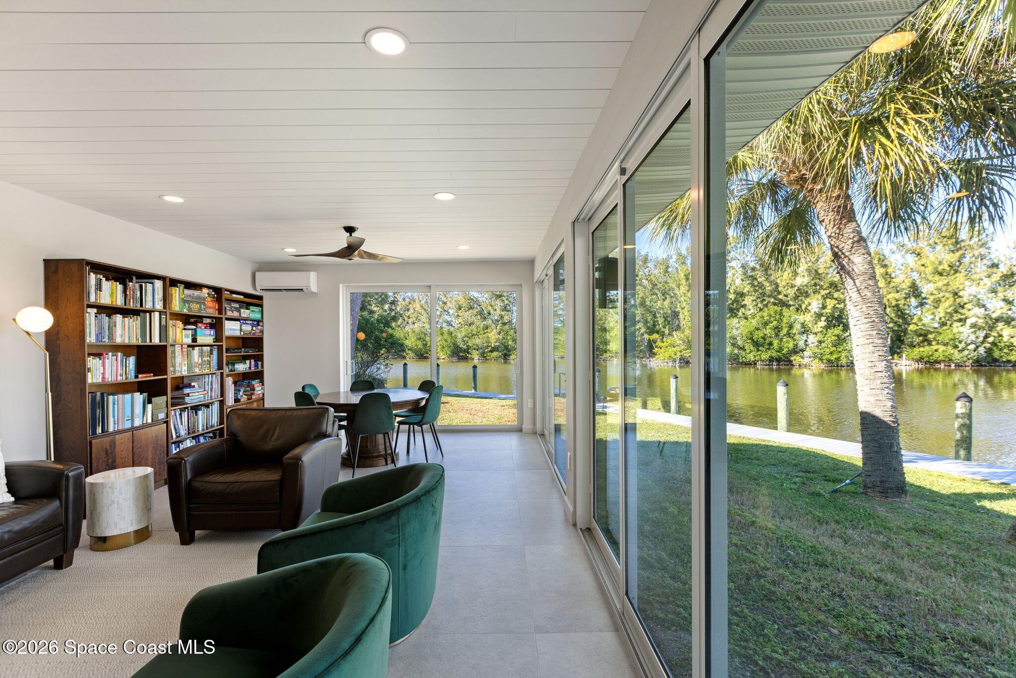 1224 Samar Road Cocoa Beach, FL 32931 - Photo 25 of 56 a living room with furniture and a large window