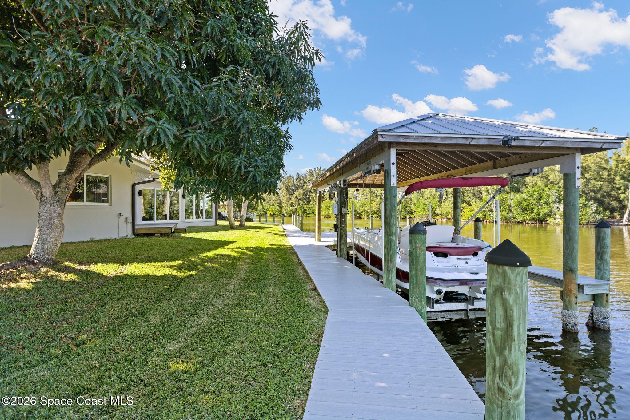 1224 Samar Road Cocoa Beach, FL 32931 - Photo 32 of 56 a front view of a house with a yard