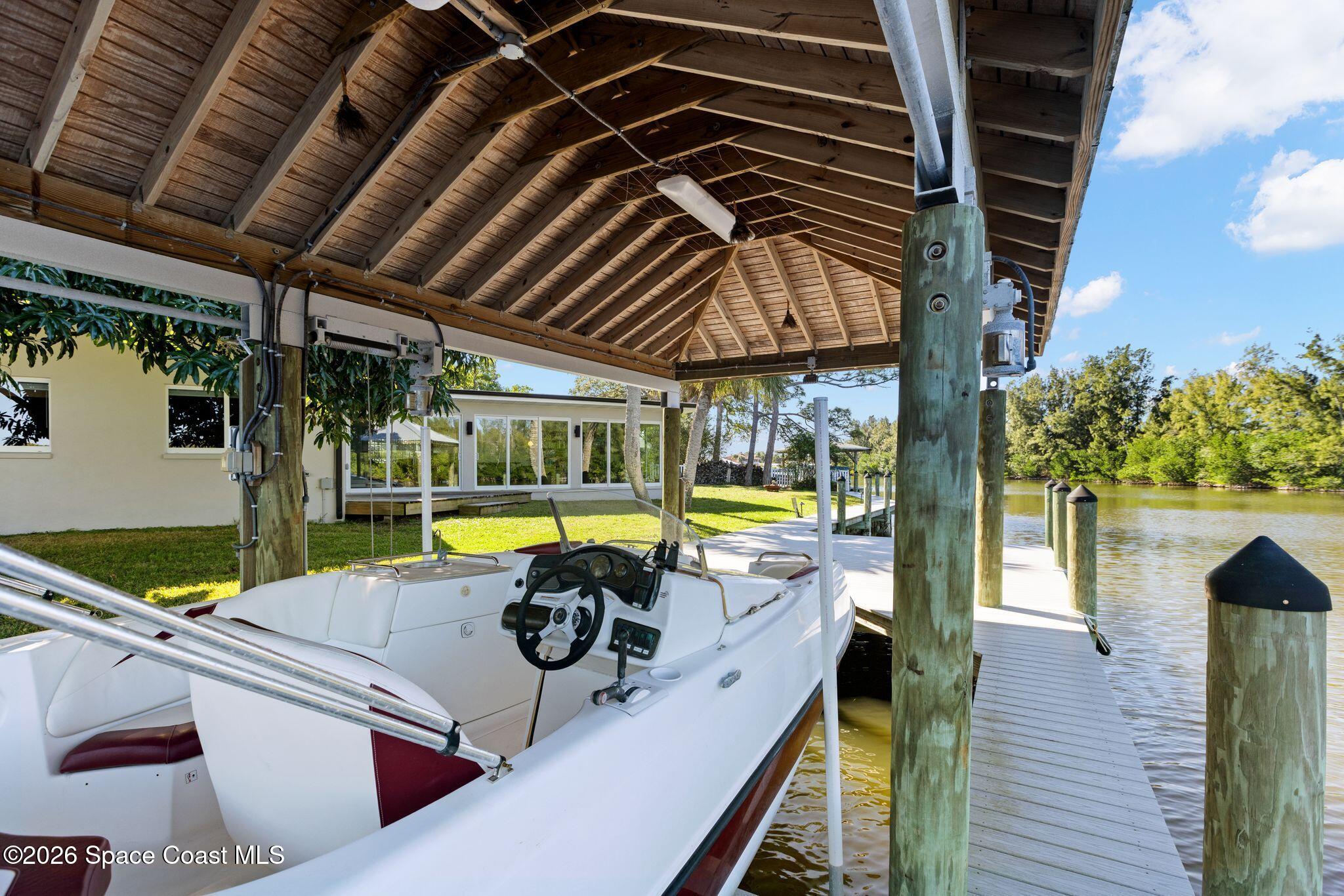 1224 Samar Road Cocoa Beach, FL 32931 - Photo 33 of 56 a view of a swimming pool with a patio