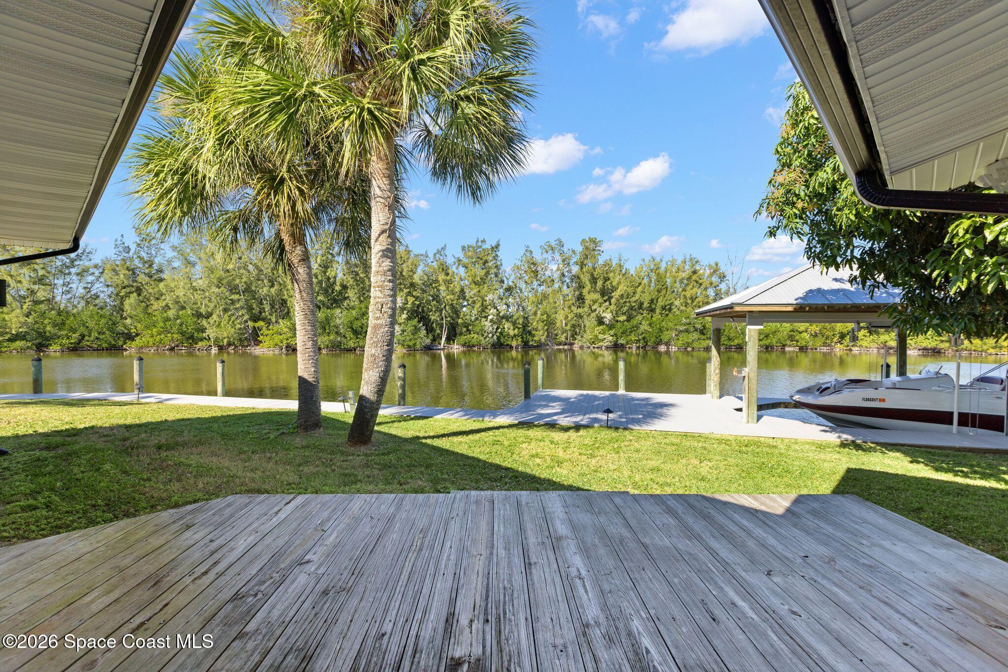 1224 Samar Road Cocoa Beach, FL 32931 - Photo 34 of 56 a view of a swimming pool with an outdoor space and seating area