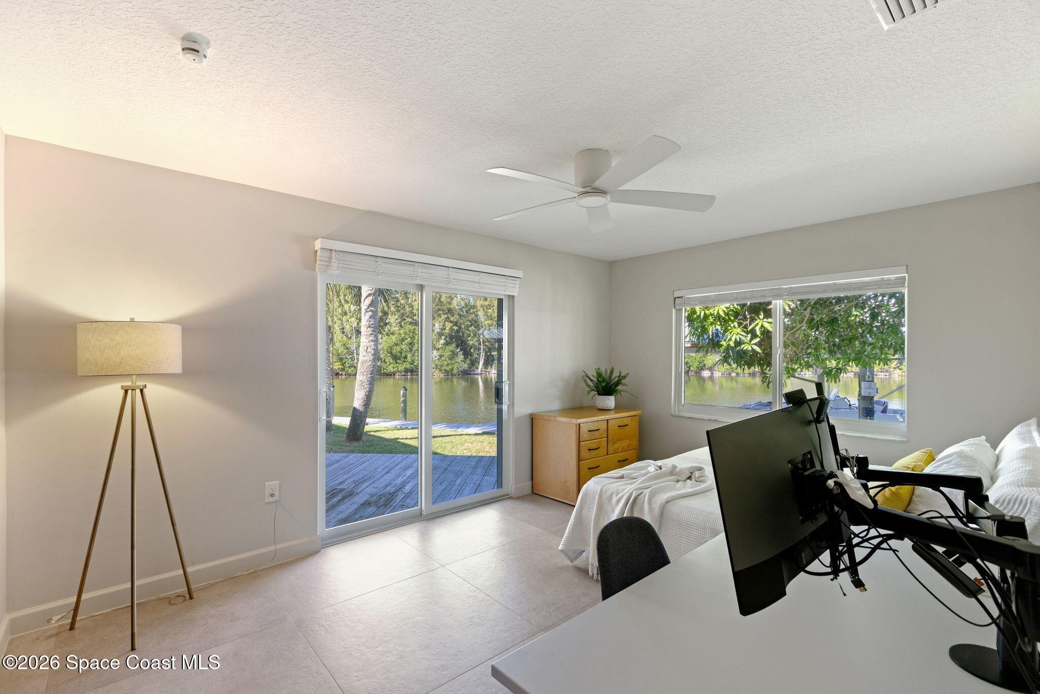 1224 Samar Road Cocoa Beach, FL 32931 - Photo 36 of 56 a view of a workspace with furniture and a window