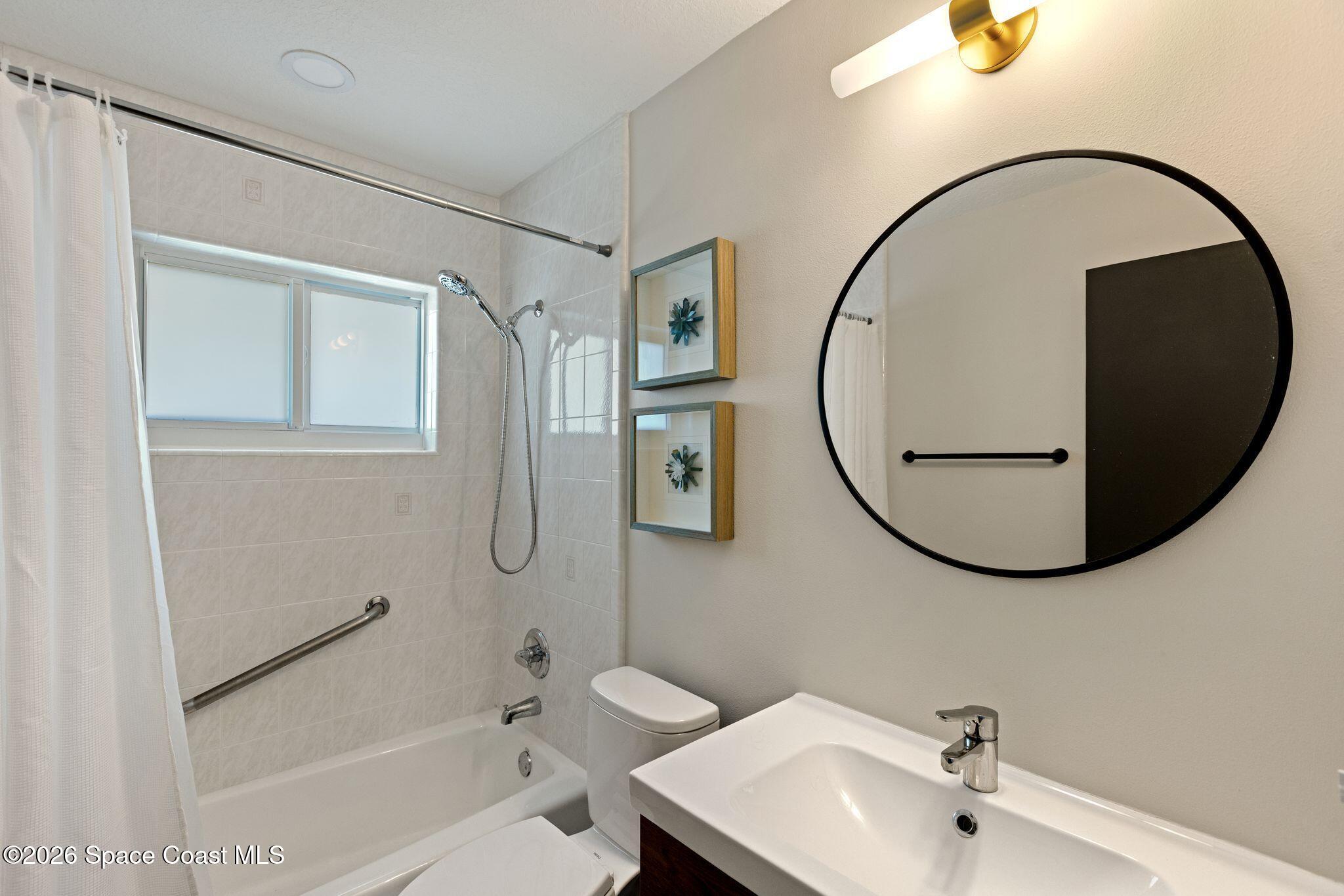1224 Samar Road Cocoa Beach, FL 32931 - Photo 37 of 56 a bathroom with a sink and a mirror