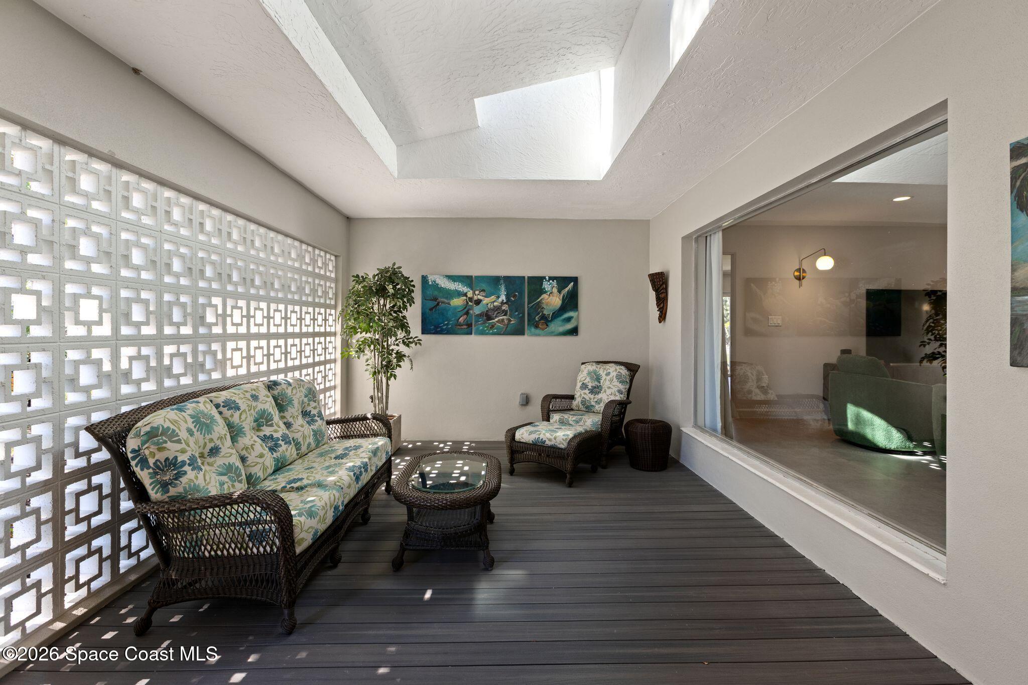 1224 Samar Road Cocoa Beach, FL 32931 - Photo 39 of 56 a living room with furniture and a table