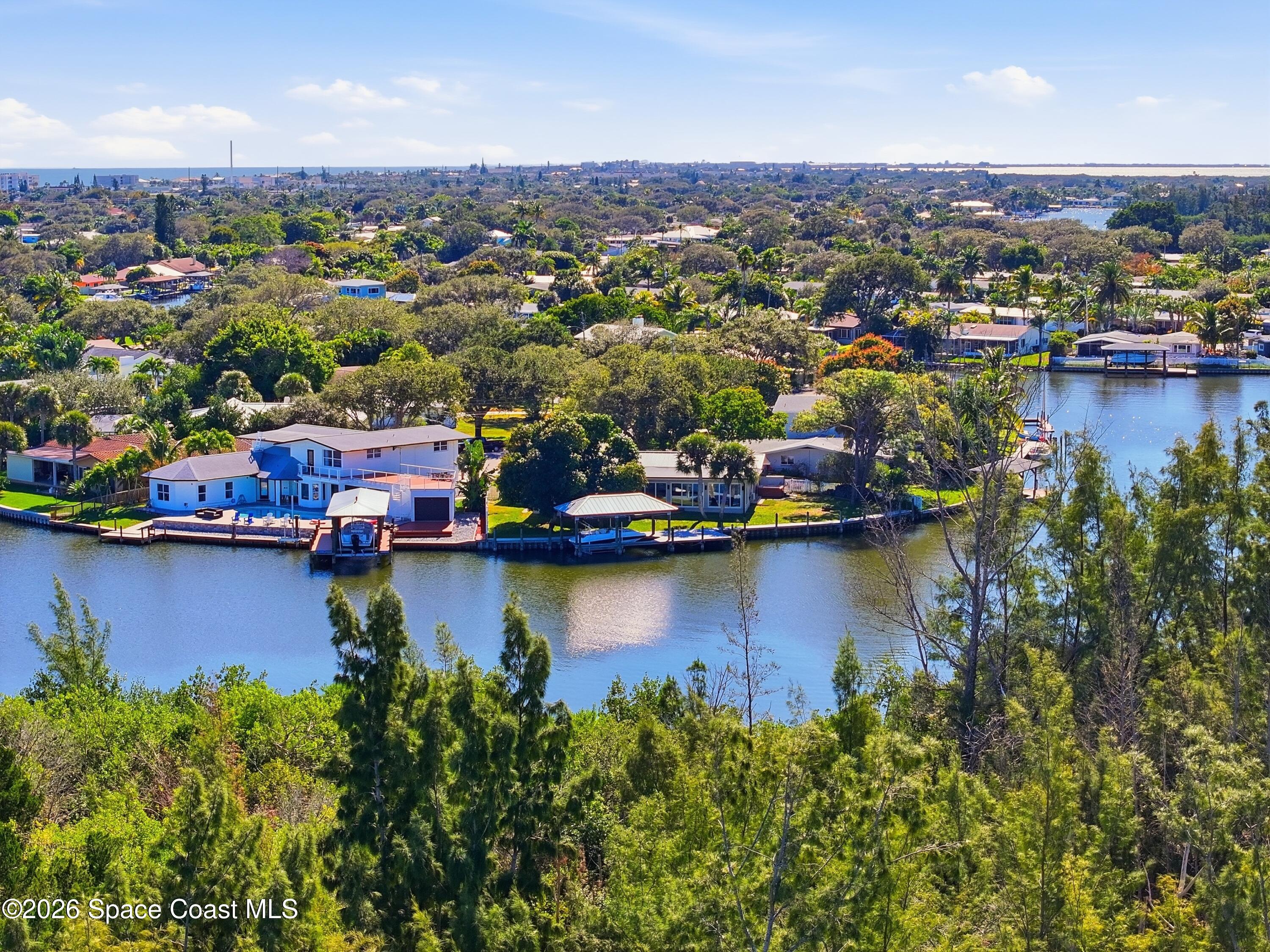 1224 Samar Road Cocoa Beach, FL 32931 - Photo 45 of 56 an aerial view of a residential houses with outdoor space and lake view