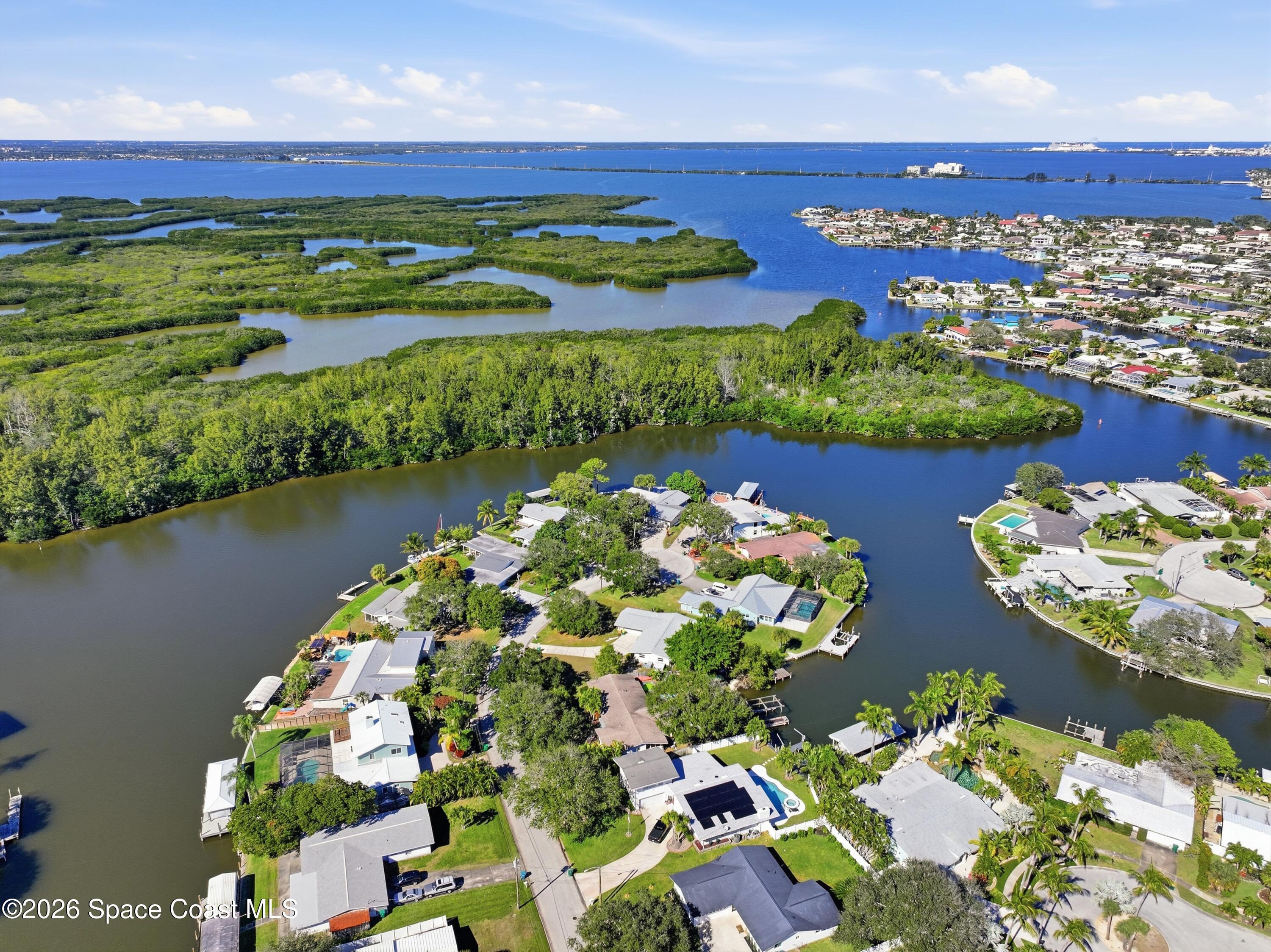 1224 Samar Road Cocoa Beach, FL 32931 - Photo 46 of 56 an aerial view of a residential houses with outdoor space and river view