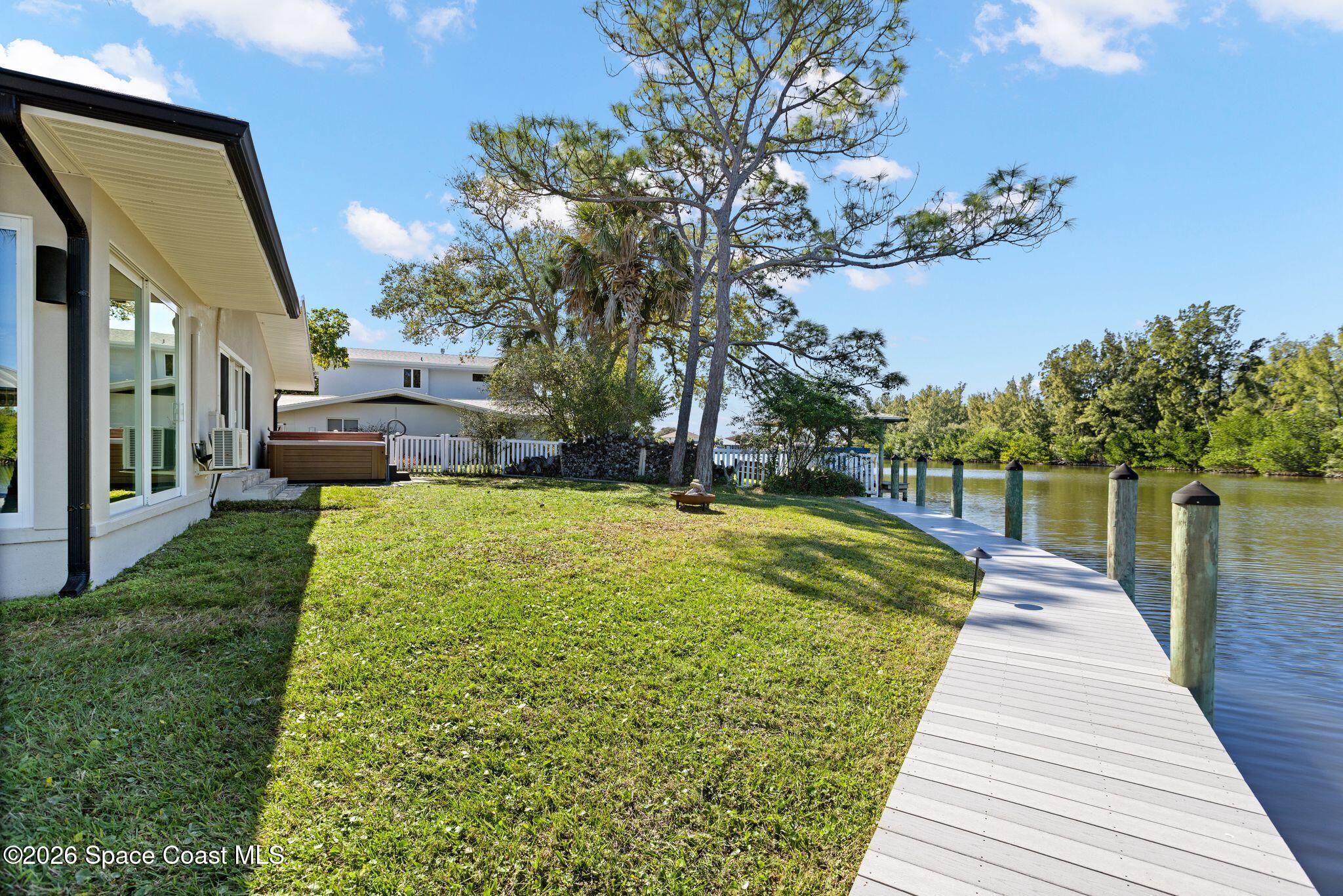 1224 Samar Road Cocoa Beach, FL 32931 - Photo 48 of 56 a view of a house with a yard