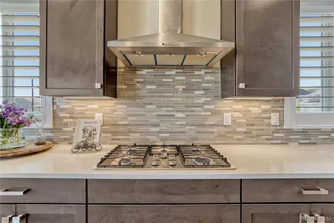 a kitchen with a stove and cabinets