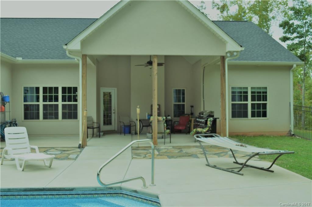 3080 Glenmoor Road York, SC 29745 - Photo 19 of 22 a view of a house with backyard sitting area and garden