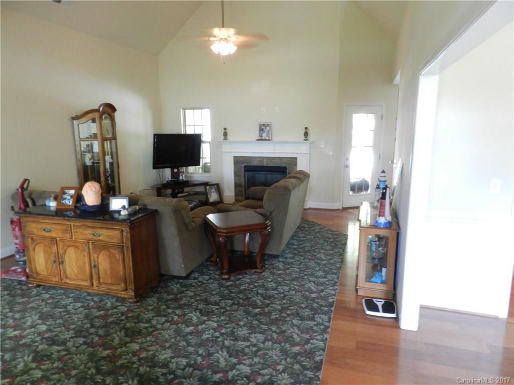 3080 Glenmoor Road York, SC 29745 - Photo 6 of 22 a living room with furniture a fireplace and a flat screen tv