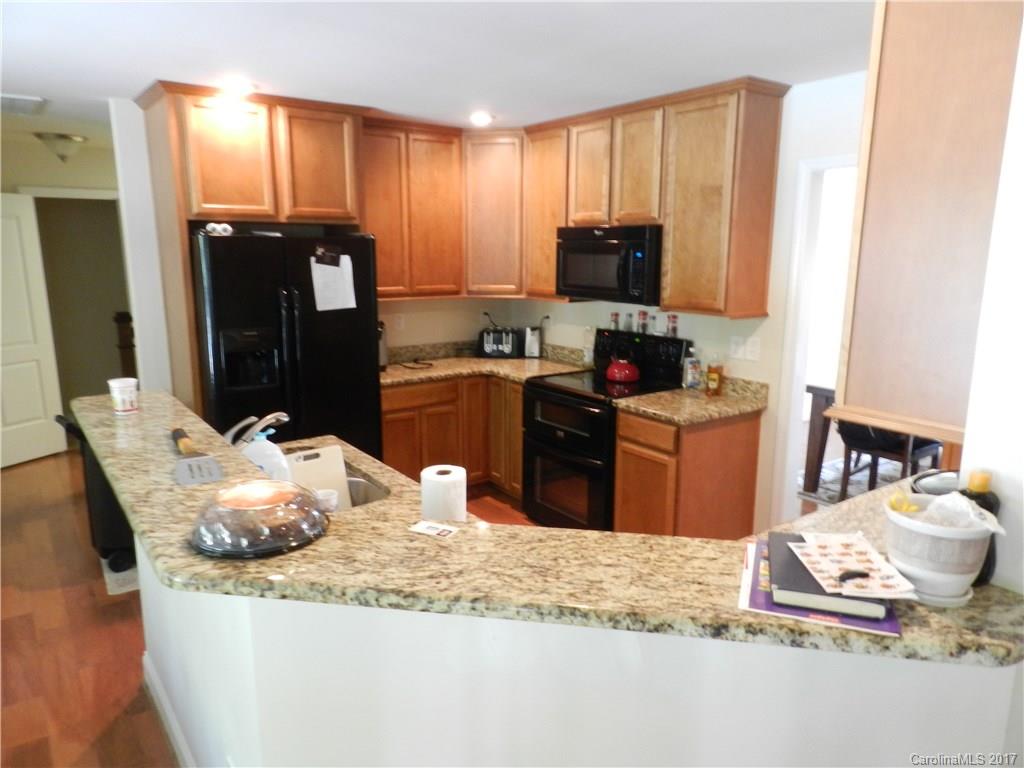 3080 Glenmoor Road York, SC 29745 - Photo 9 of 22 a kitchen with granite countertop a refrigerator stove and sink