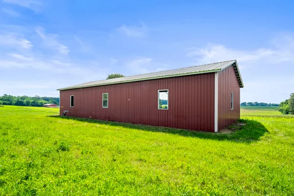 a view of a backyard with potted plants