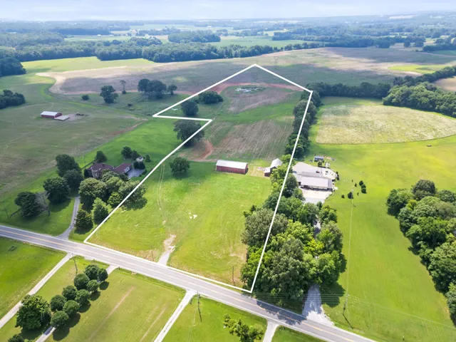 a view of a swimming pool with a yard