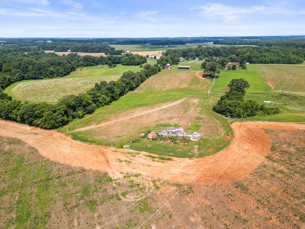 an aerial view of a house with a lake view