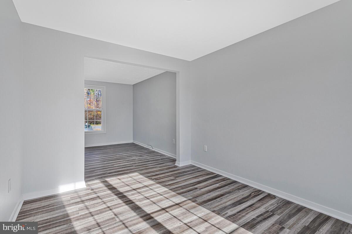 123 Cove Point Road Lusby, MD 20657 - Photo 11 of 38 a view of an empty room and wooden floor