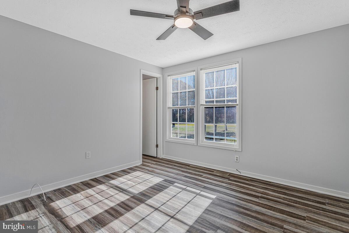 123 Cove Point Road Lusby, MD 20657 - Photo 21 of 38 a view of an empty room with a window