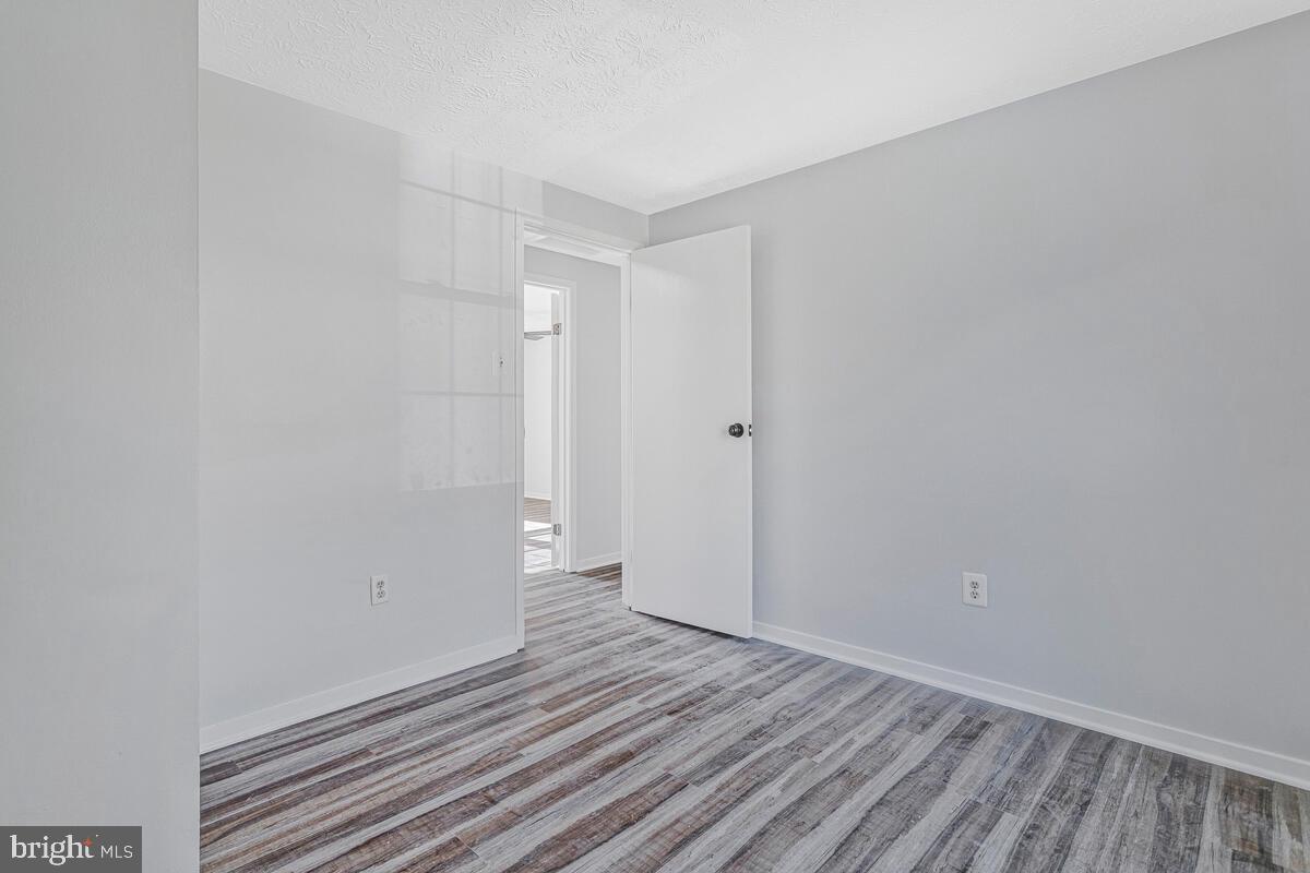 123 Cove Point Road Lusby, MD 20657 - Photo 24 of 38 a view of room with wooden floor