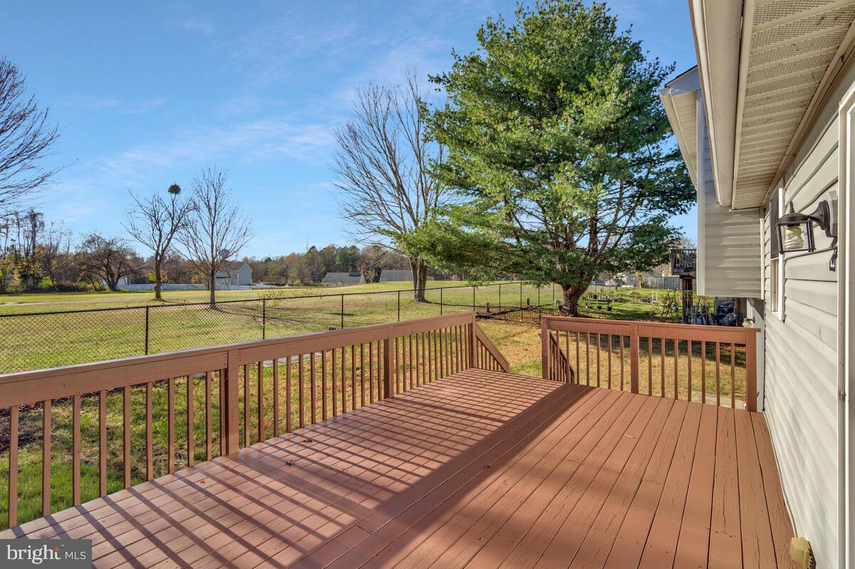 123 Cove Point Road Lusby, MD 20657 - Photo 3 of 38 a view of balcony with wooden floor and fence