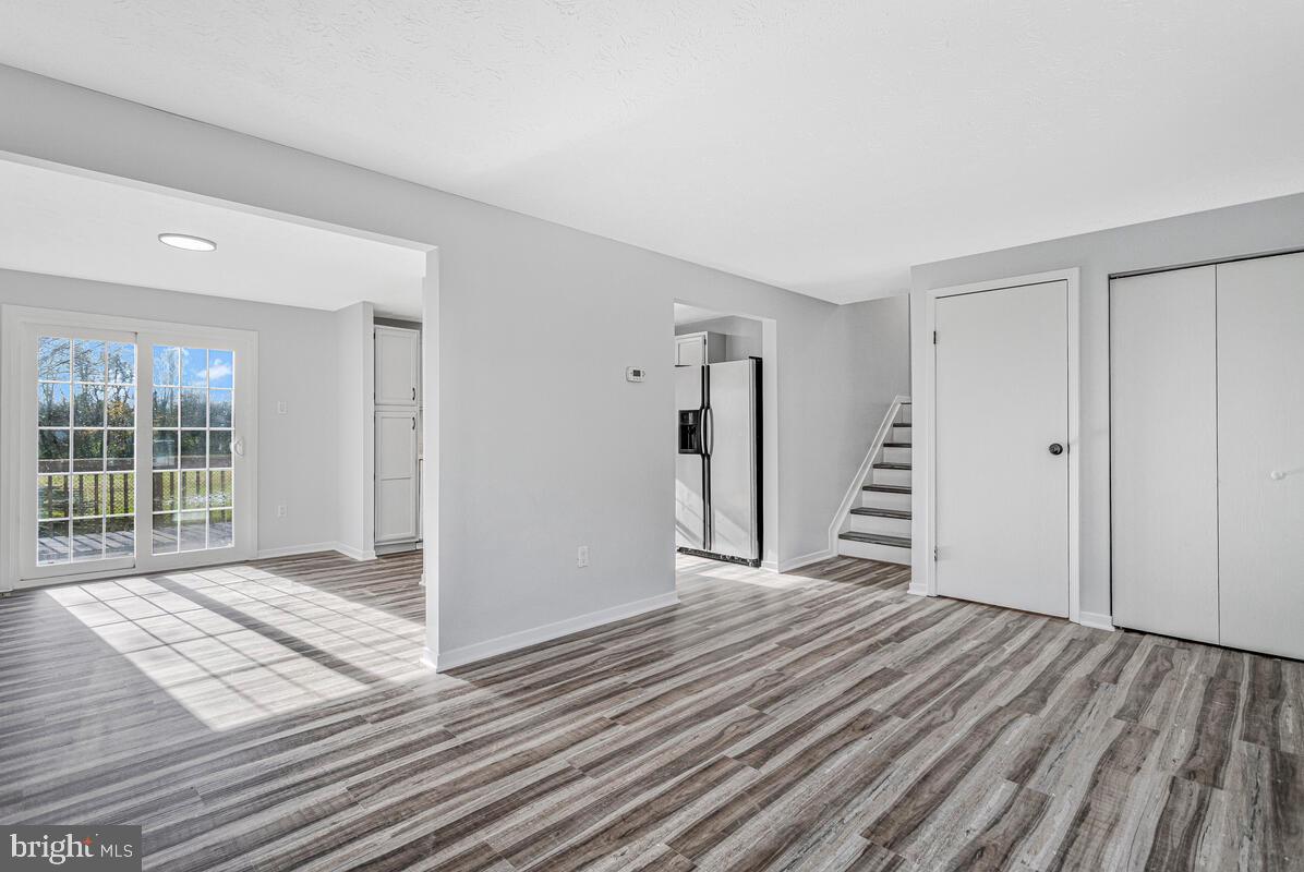 123 Cove Point Road Lusby, MD 20657 - Photo 8 of 38 a view of a room with wooden floor and entryway