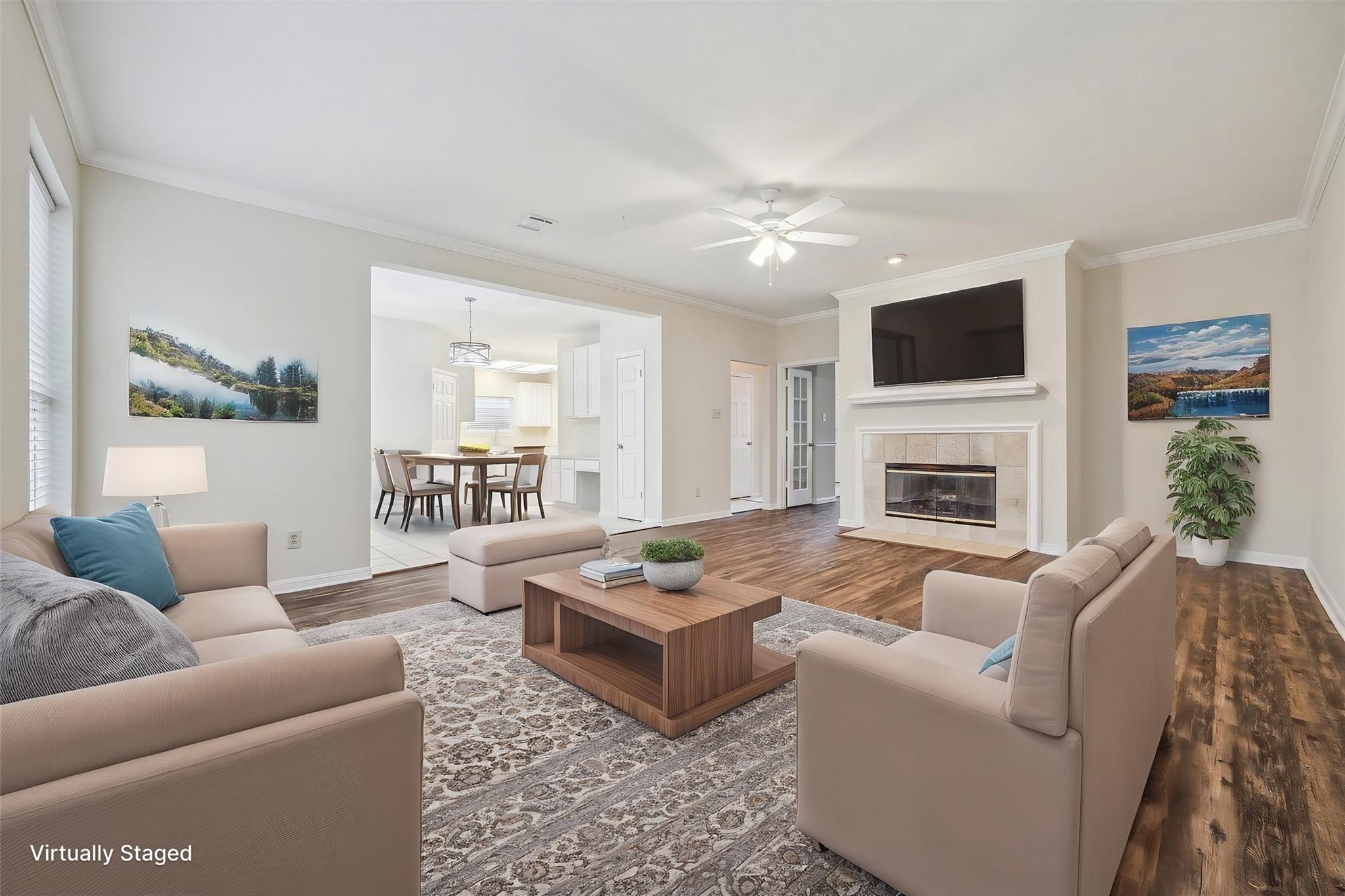 16403 Wellers Way Houston, TX 77095 - Photo 11 of 26 a living room with furniture a flat screen tv and a fireplace