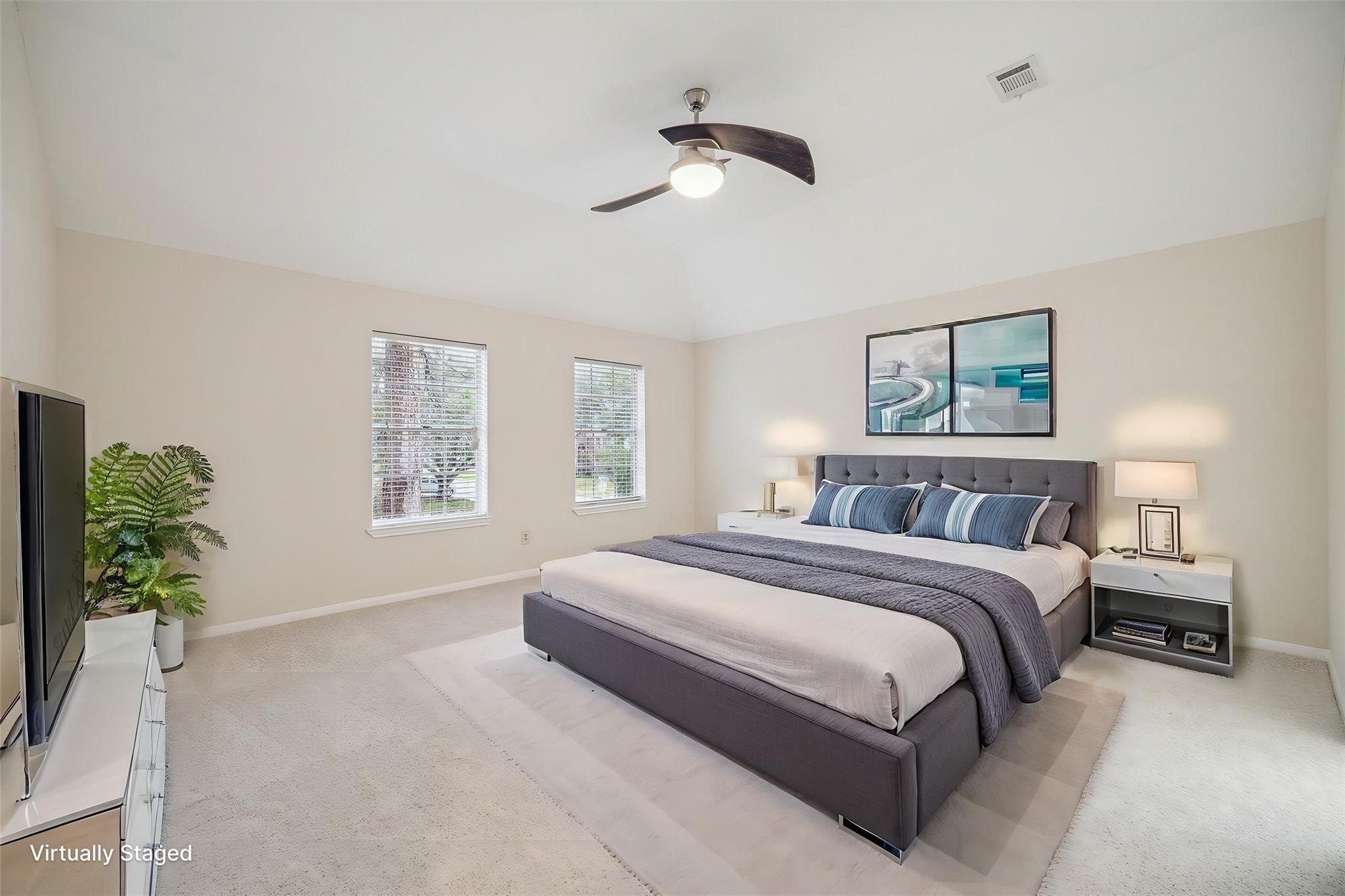 16403 Wellers Way Houston, TX 77095 - Photo 14 of 26 a spacious bedroom with a large bed chandelier and a window