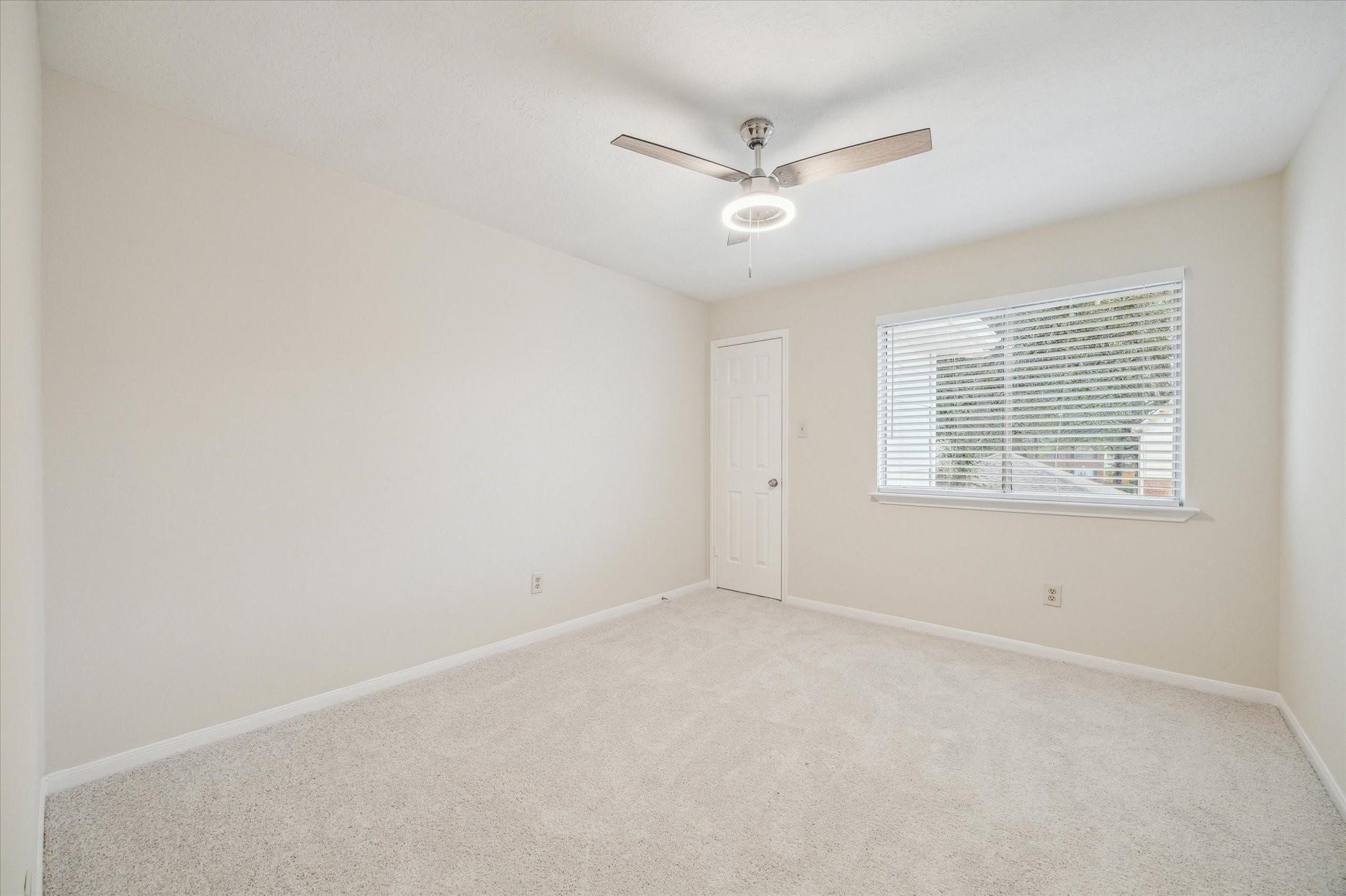 16403 Wellers Way Houston, TX 77095 - Photo 20 of 26 a view of an empty room with a window