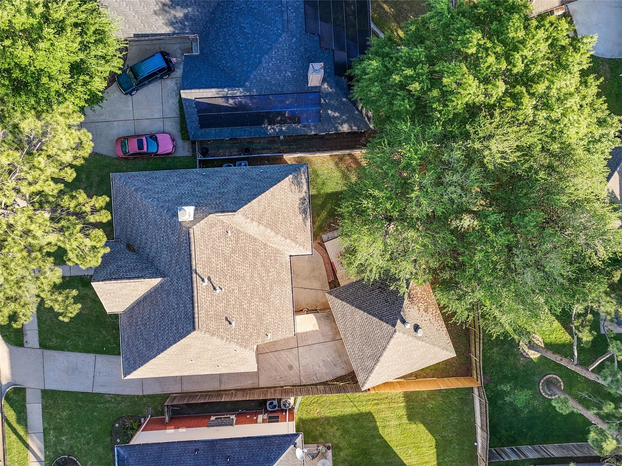 16403 Wellers Way Houston, TX 77095 - Photo 2 of 26 an aerial view of a house with a yard and a large tree