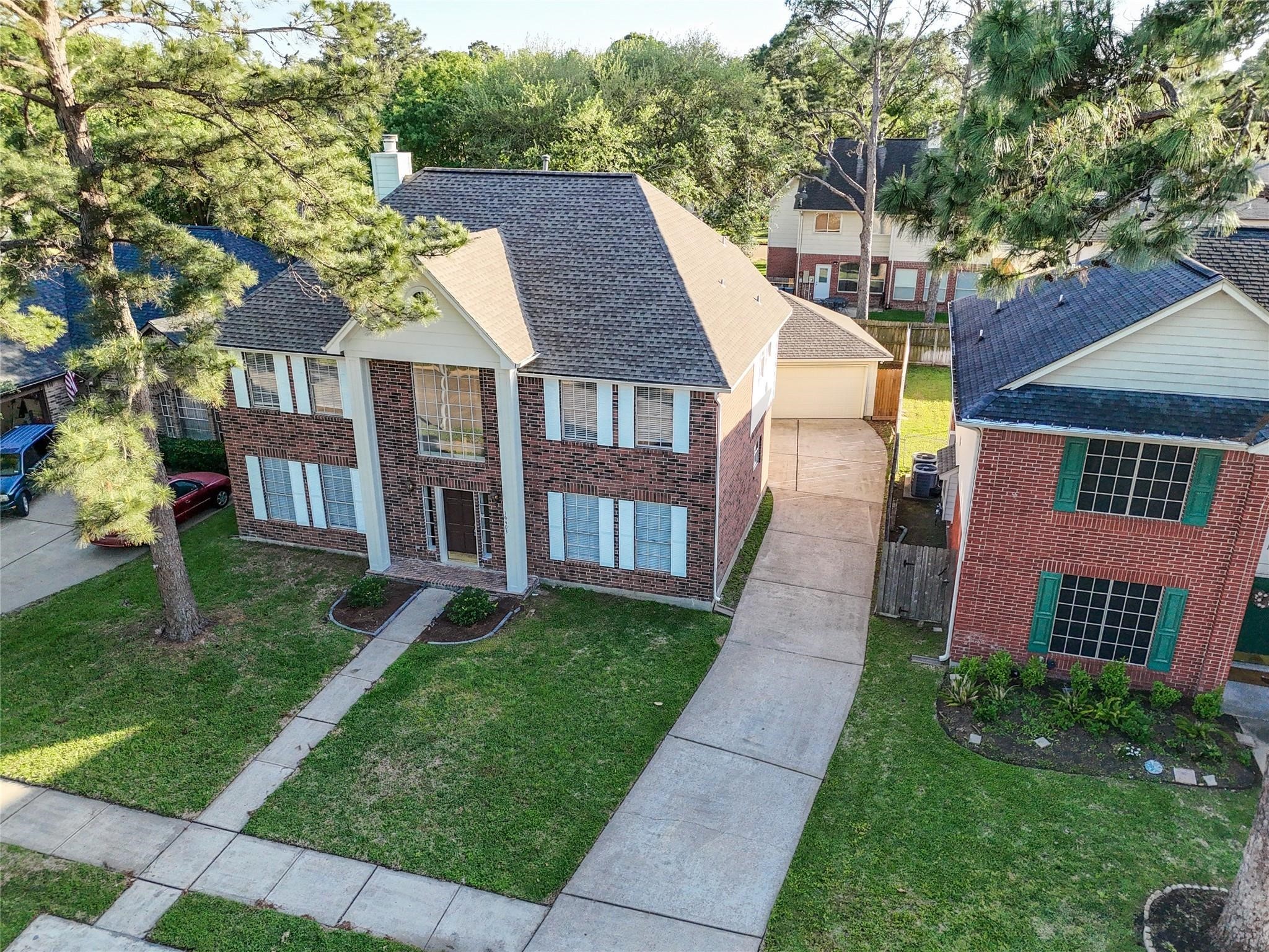 16403 Wellers Way Houston, TX 77095 - Photo 26 of 26 front view of a house with a yard