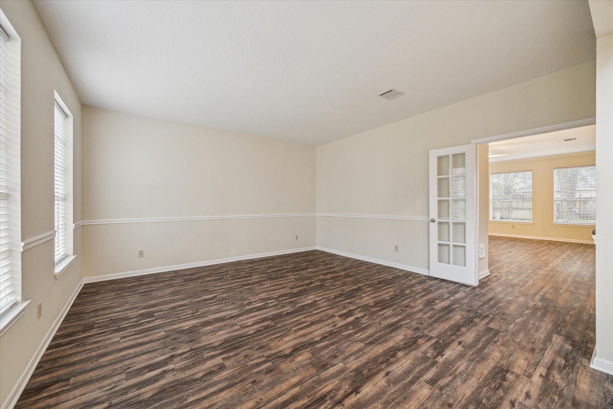 16403 Wellers Way Houston, TX 77095 - Photo 5 of 26 wooden floor in an empty room with a window